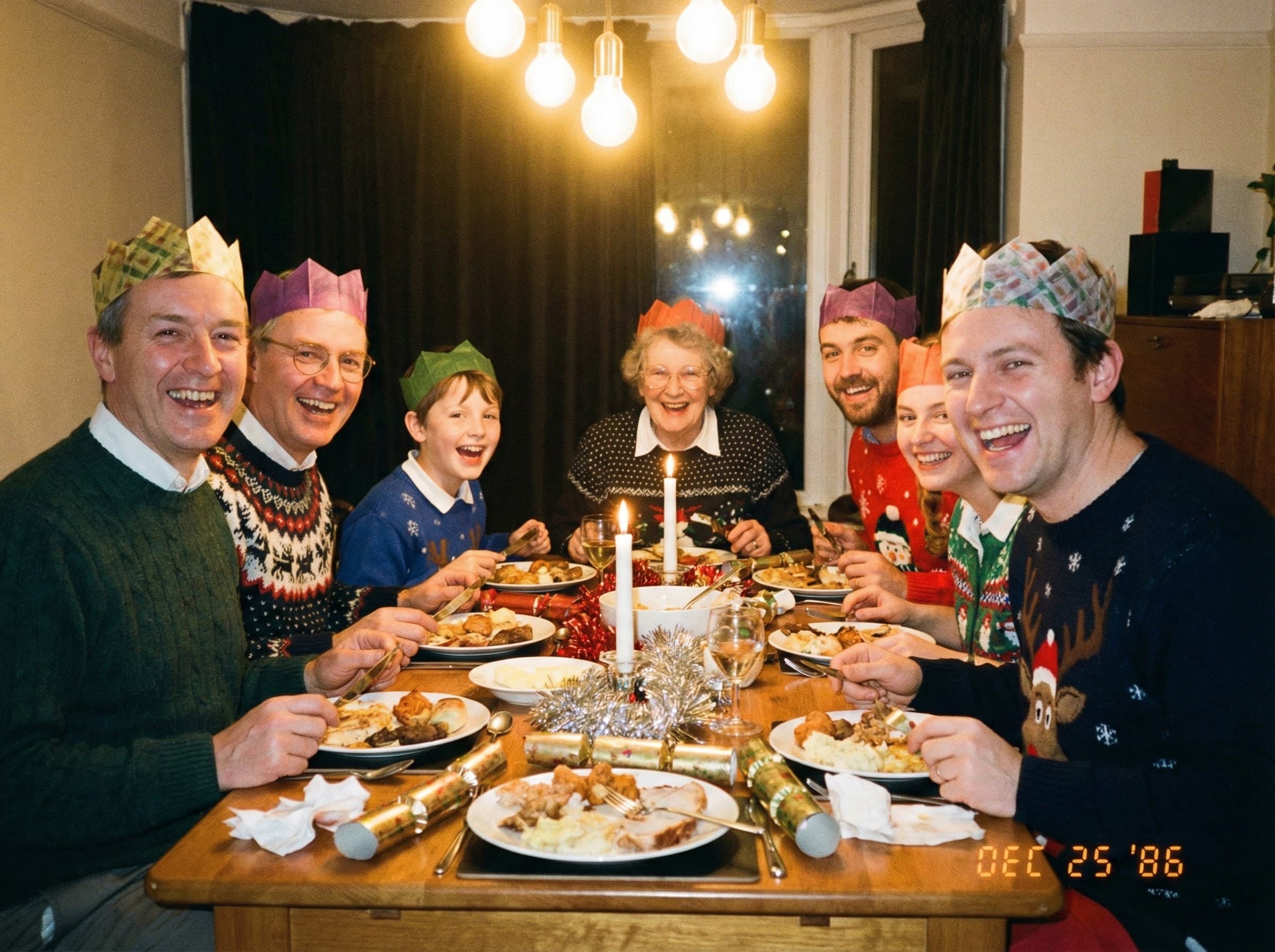 British family Christmas dinner with paper crowns - Dec 25 1986
